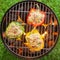 Grilling stuffed savory bell peppers on the BBQ