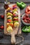 Before grilling tasty skewers with vegetables and meat in summer