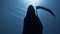 Grim Reaper with scythe turning back, walking away to give victim second chance