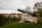 Grimstad, Norway - October 22, 2017: Salute canon standing on Kirkeheia, with Grimstad city seen below in the background