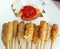 grinded chicken rolls with flour on a skewer or Indonesian food chicken Sempol