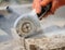 Grinder worker cuts a stone