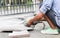 Grinder worker cuts a stone tile