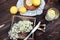 Grinding lemon and black elderberry on a cutting board to make an herbal drink or medicine for healing at home from