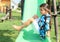 Grinning girl on a slide