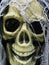 Grinning human skull with deep, hollow black eyes, closeup