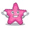 Grinning pink starfish in the cartoon shape