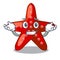 Grinning red starfish animal on mascot sand