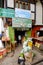 Groceries store with many sacks and boxes with produce outside on a street in Paro, Bhutan.