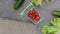 Grocery basket and burlap fabric with vegetables rotation on the background of gray.