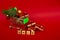 Grocery basket with golden gift boxes and Christmas balls, a sprig of Christmas tree and English letters SALE on a red background