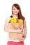 Grocery. Girl holding paper shopping bag with fruits