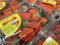 Grocery store packaged strawberries on display close up