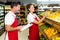 Grocery store staff with clipboard