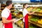 Grocery store staff with clipboard