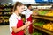 Grocery store staff with clipboard