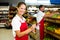 Grocery store staff with clipboard