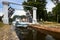 Grodno - August 2021: boat Neman with tourists enters Dombrovka lock on Augustow Canal, Avgustovski channel or Kanal