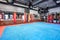 GRODNO, BELARUS - APRIL 2019: Hall of martial arts with fighting ring and punching bags in the modern Fight club