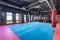 GRODNO, BELARUS - APRIL 2019: Hall of martial arts with fighting ring and punching bags in the modern Fight club