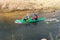 GRODNO, BELARUS - APRIL, 2019: kayak freestyle competition on fast cold water river strenuously rowing, spirit of victory