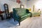 GRODNO, BELARUS - DECEMBER 2018: green bench in chester style for elite loft interior in expensive store showroom of furniture