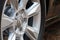 GRODNO, BELARUS - DECEMBER 2019: Audi A6 4G C7 Luxury car closeup alloy wheel part side view with titanium look matt