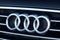 GRODNO, BELARUS - DECEMBER 2019: Audi logo and badge on car grill. Closeup of chromium plated metal logotype on dark