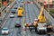 Grodno, Belarus, January 18, 2022: Employees of the road service in special yellow vests perform work on the repair of the roadway