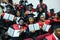 GRODNO, BELARUS - JUNE, 2018: Foreign african medical students in square academic graduation caps and black raincoats during