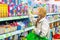 Grodno, Belarus, May 20, 2023: An attractive blonde girl in a toy store chooses a gift for a child. A girl in a shopping mall