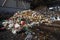 GRODNO, BELARUS - OCTOBER 2018: waste at garbage processing plant huge pile of garbage prepared for loading to conveyor belt for