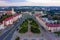 Grodno Regional Drama Theater and Holy Cross Church And Traffic In Mostowaja And Kirova Streets in the morning light. Grodno city