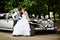Groom adn bride about retro limousine