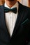 Groom black suit with a bow tie