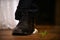 The groom breaks the glass with his foot under the chuppah at a traditional Jewish wedding