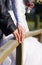 Groom and the bride cost on the wooden bridge