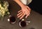 Groom and bride hands with rings on the table with two coffee cups, closeup top view