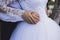 The groom and the bride hold hands