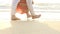Groom Bride in Long Walk Barefoot in Shallow Water by Surf