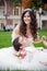 Groom and bride relaxing on a grass