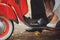 Groom and bride riding on the red motorbike