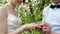 Groom dresses bride wedding ring in a spring garden