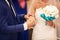 Groom dresses a ring on finger to the bride