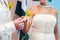 Groom dresses a ring on finger to the bride