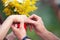 Groom dresses a ring on finger to the bride