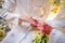 The groom is dressing the ring to the bride`s hand