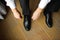 Groom dressing up with classic, elegant shoes.