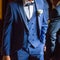 Groom in elegant suit with boutonniere