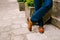 Groom feet on the background of a stone wall